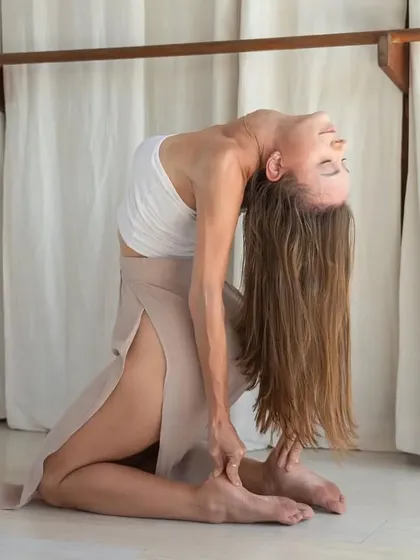 A beautiful demonstration of a deep Camel Pose (Ustrasana). This pose requires significant flexibility in the spine and openness in the chest, which we develop through consistent practice.