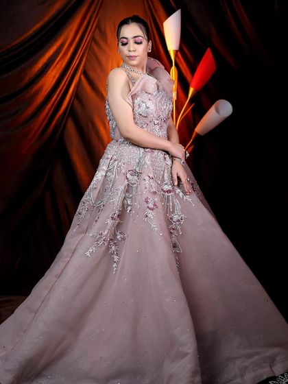 Another shot of the model in the beautiful lavender gown. The full-length view shows how the makeup complements the ethereal and glamorous nature of the dress.