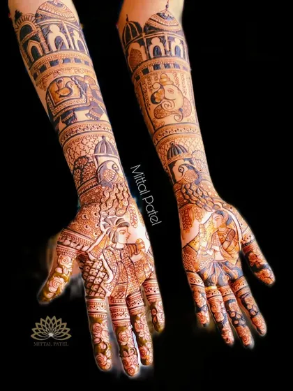 Another view of the heavy bridal mehndi against a black background, highlighting the beautiful contrast and the complexity of the design.