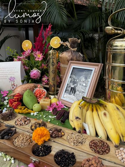 A detailed shot of the nine sacred grains, mangoes, and coconuts, part of a traditional South Indian wedding decor.