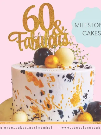 Marking a 60th birthday with modern flair, this cake features a stylish abstract design with gold and black splatters. Topped with chocolate spheres and a "60 & Fabulous" topper, it's a chic and celebratory cake for a major milestone.
