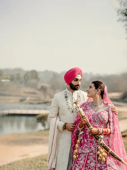 We believe in capturing the couple within the beauty of their chosen location. This portrait from a Sikh wedding by the lake shows how we blend stunning landscapes with the couple's serene presence to create a truly memorable destination wedding photograph.