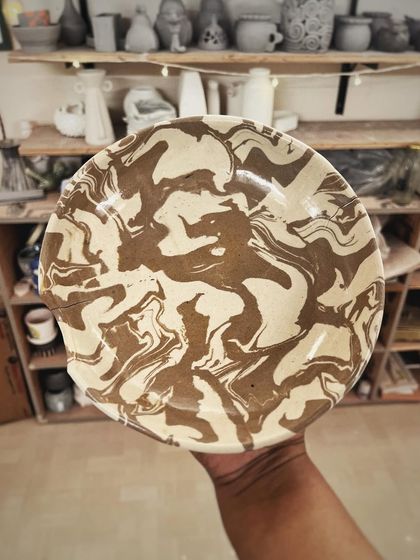 This student created a wonderful variety of forms and textures in her beginner's course, from a marbled Nerikomi bowl to a textured mug with a unique handle.