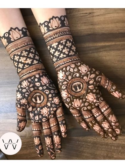 A lovely baby shower design featuring tiny baby footprints in the center of lotus-filled mandalas.