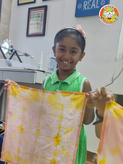 A huge smile and a beautiful, naturally dyed handkerchief. This eco-friendly art activity is both educational and incredibly fun.