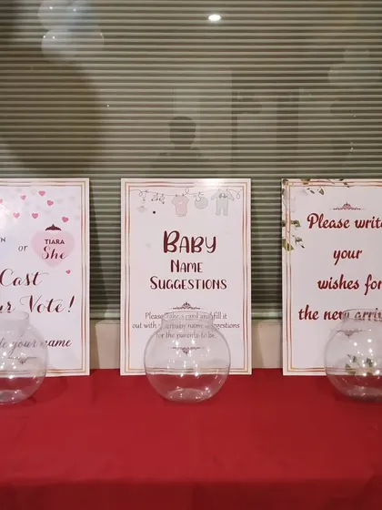 We also provide interactive elements for baby showers, like these signs and bowls for guests to cast votes, suggest names, and write wishes for the new baby.