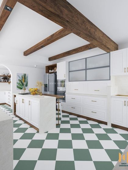 A kitchen renovation where we added a chic island counter with a breakfast bar. The green and white checkerboard flooring adds a touch of modern-classic charm.