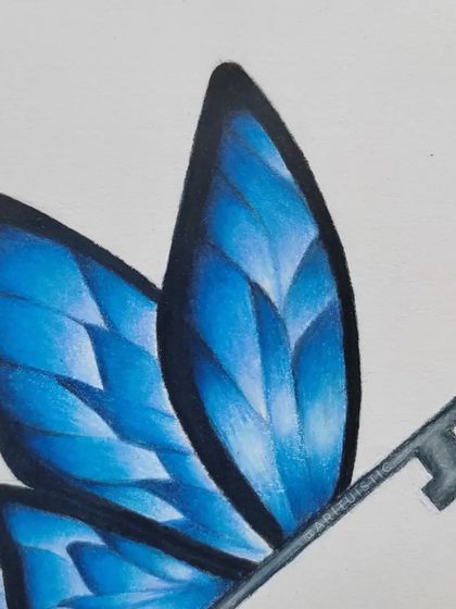 A close-up of the enchanted key's butterfly wings, showing the gradient of blues.