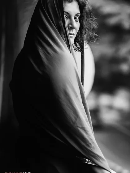 In monochrome, distractions fade away, revealing the soul's true expression. This fine art black and white portrait was created during a quiet, meditative session, allowing the subject's inner world to emerge through a simple, powerful gaze.