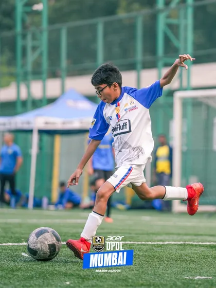 A player taking a powerful shot on goal during a DPDL match.