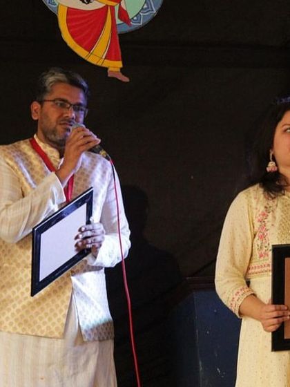 Receiving a token of appreciation on stage with Saurabh after our performance at TEDx Sri Venkateswara College. We are always thankful for the recognition of our work.