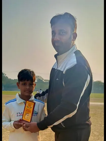 Sumit being recognized for his excellent bowling performance.