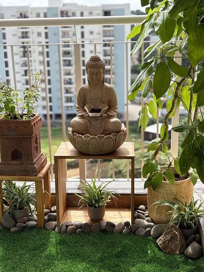 I can help you create a zen corner on your balcony, a perfect escape from the city buzz. This setup features a calming Buddha water fountain, hardy plants that love the sun, and natural stone details, all coming together to create a truly serene atmosphere.