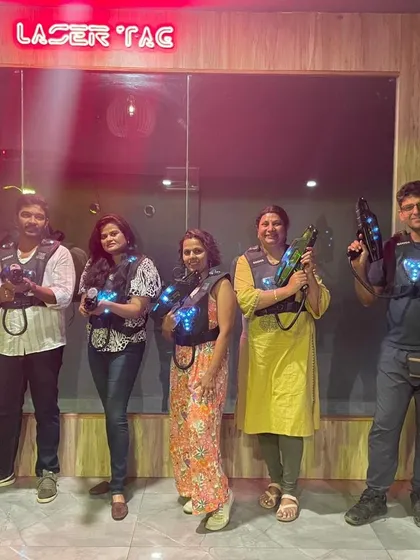 A group of friends ready for a laser tag battle to celebrate a birthday. It's a fun and active way to make any birthday party unforgettable.