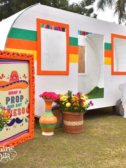 I converted a caravan into a photo booth, decorated with colorful frames and props, providing a unique and interactive experience for guests.