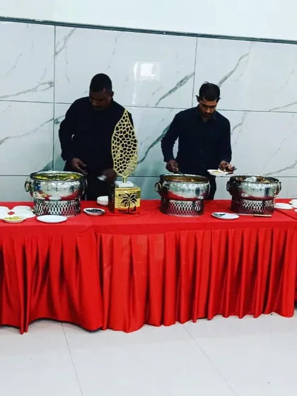 My service staff setting up the buffet for a full-day catering event. They work efficiently to ensure everything is perfectly in place for breakfast, lunch, and dinner service.