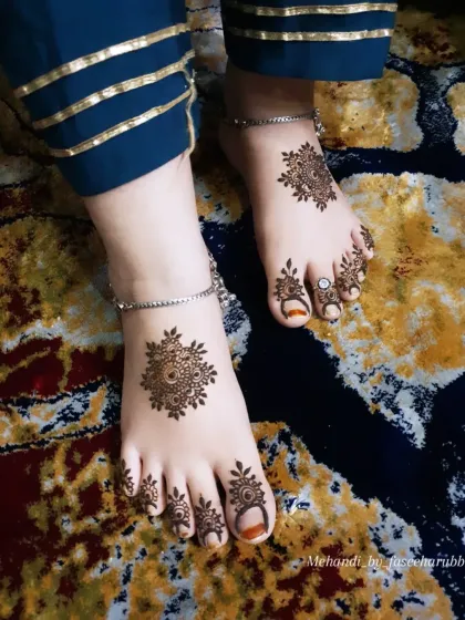 This angle shows the beautiful symmetry of the mandala designs on both feet.