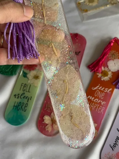 This shimmery bookmark with delicate, skeletal leaves is a unique and ethereal piece from the sale.
