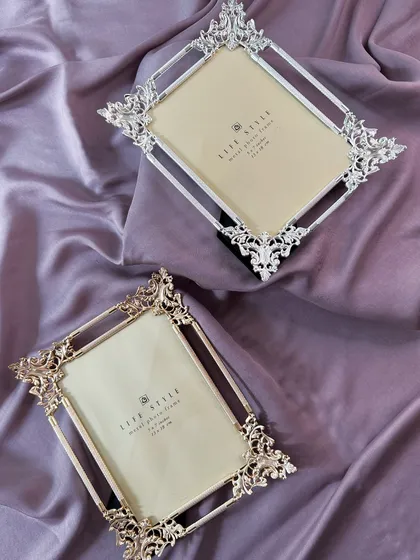 Ornate silver and gold frames with intricate, baroque-style detailing. These are crafted to bring a touch of classic luxury and grandeur to your most treasured photographs.