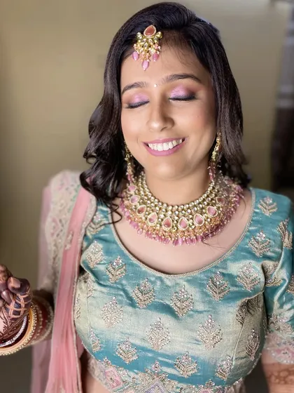 The final reception look for this beautiful bride. The soft pink eyeshadow and glowing skin create a dreamy and romantic vibe.