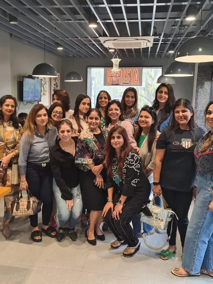 A full house of happy faces! This photo captures the incredible energy of our community. We are a group of women who seek to rise above the ordinary through the power of reading and connection.