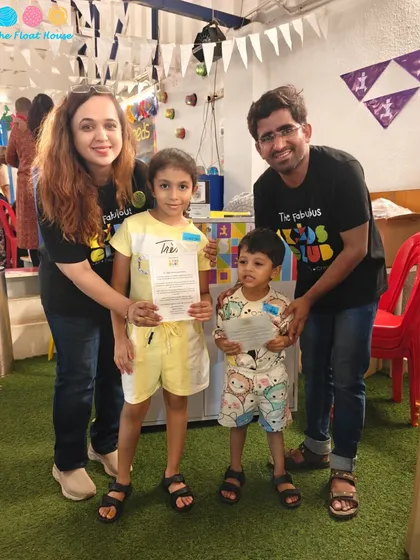 Kids receiving certificates at the end of a club event. We celebrate every achievement and make sure our young guests feel accomplished.