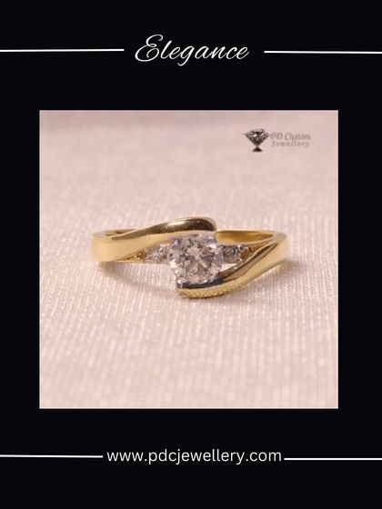 An elegant solitaire ring in 18kt hallmarked gold. The band has a gentle twist, beautifully showcasing the central diamond. A timeless choice for an engagement.