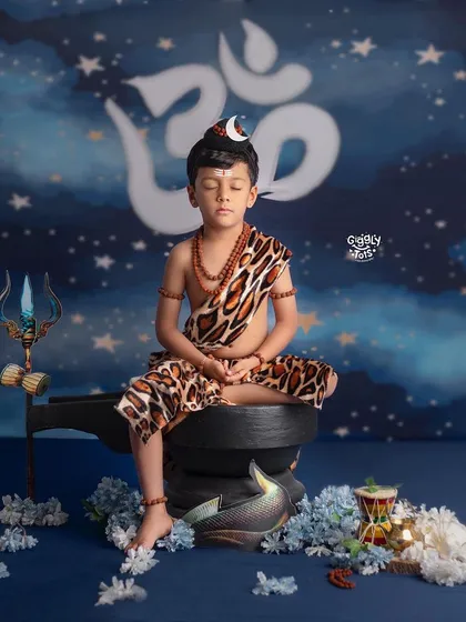 Capturing divinity in its purest form. This little one embodies the serene and powerful spirit of Shiva in our special Shivratri theme, complete with a damaru and trishul.