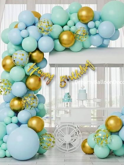 An elegant mint green and gold balloon arch. This large, organic-style arch is perfect for framing a dessert table or entrance at a birthday party, baby shower, or any chic event.