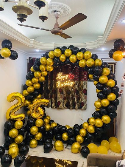 Another angle of the 26th birthday decor, showing the full circle of balloons.
