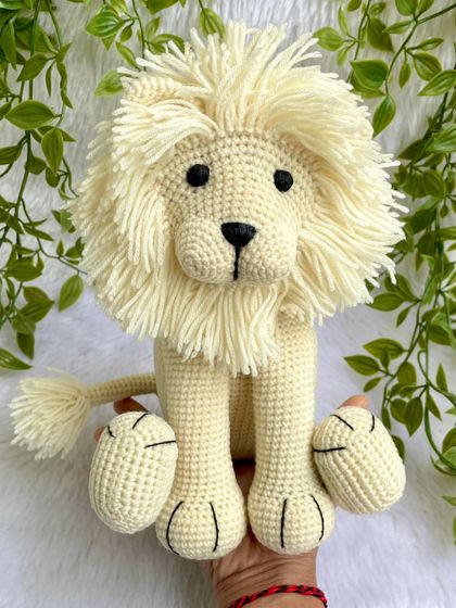 This majestic white lion has such a beautiful, full mane. I love making this sitting version, which is perfect for display in a nursery or for gentle play. The details on his paws make him extra special.