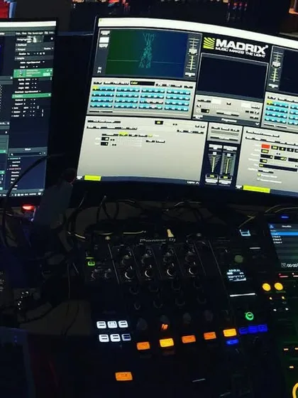 This is my command center. I'm not just playing tracks; I'm performing as a DJ and a VJ simultaneously. Using Pioneer DJ gear for the sound and Resolume with Madrix for the visuals, I create a complete sensory experience from the console.