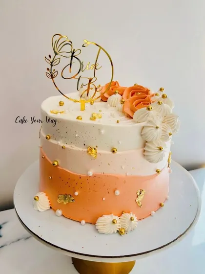 A cake as elegant as the bride-to-be. This ombre cake with gold leaf and flowers is perfect for a bridal shower.