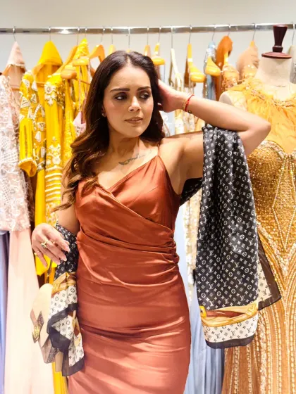 A closer look at the Pantone color of the year. The satin-finish dress paired with a contrasting scarf creates a beautiful texture play, perfect for a semi-formal event.