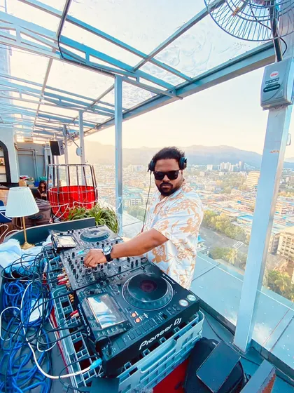 Setting the vibe at a rooftop sundowner event at LIV in Mumbai. With the city skyline as the backdrop, I curate a mix of Afro House and chill beats that perfectly complements the sunset and the mood.