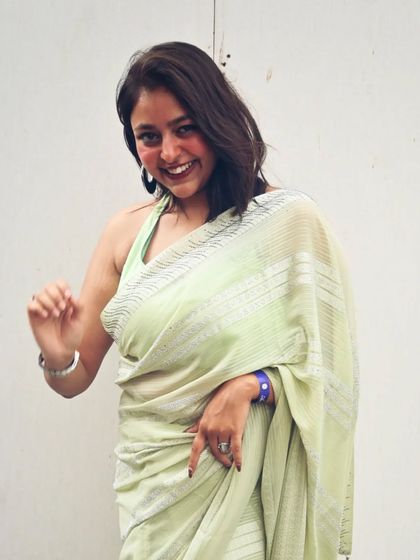 A fun, interactive pose, inviting you to join the party. This captures the engaging and welcoming vibe I bring as a host.