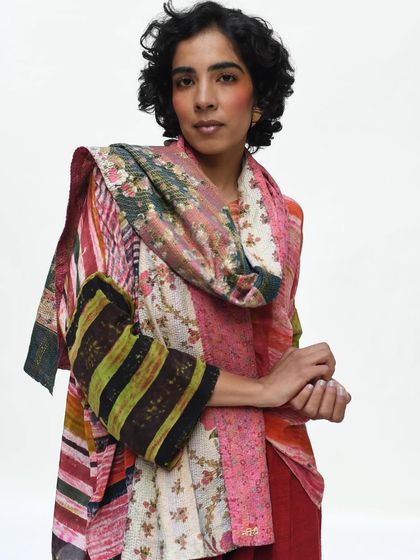 A vibrant, multi-patterned look that celebrates color and craftsmanship. This image shows how to fearlessly mix prints for a stunning result.