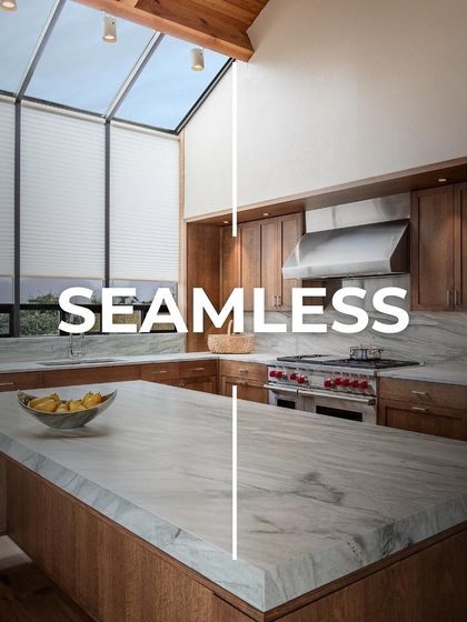 This kitchen is a perfect example of a seamless design, where the marble countertop and backsplash appear to be one continuous surface. Paired with natural wood cabinets, it creates a warm yet modern feel.