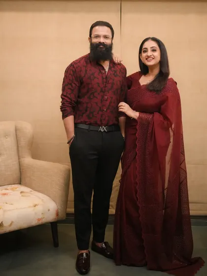A beautiful portrait of actor Jayasurya and his wife Saritha. She looks stunning in the maroon saree I draped for her.