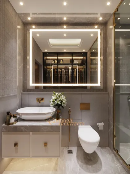 This bathroom design makes even the busiest mornings feel like a calm retreat, with its clean lines, backlit mirror, and integrated walk-in closet.