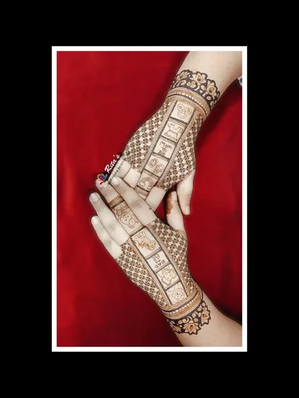 The back of the hands for a baby shower mehendi, with cute teddy bear patterns.