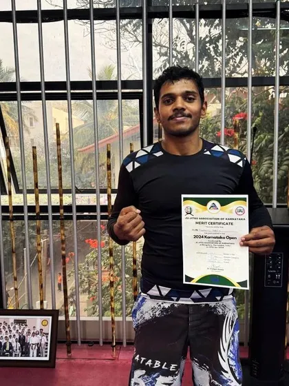 Holding my certificate and gold medal from the 2024 Karnataka Open BJJ tournament. It's always an honor to compete and represent our gym in local events.