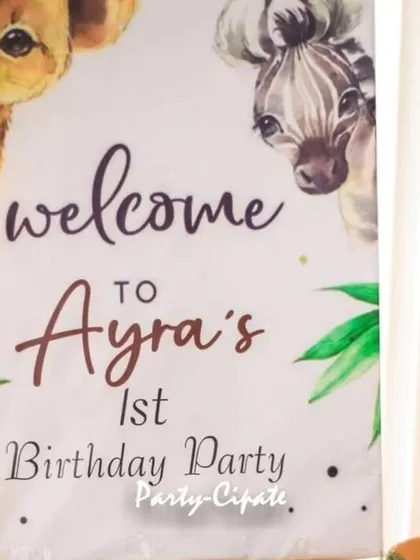 A personalized welcome sign is the perfect start to any party. This one for Ayra's first birthday featured adorable safari animals peeking out.