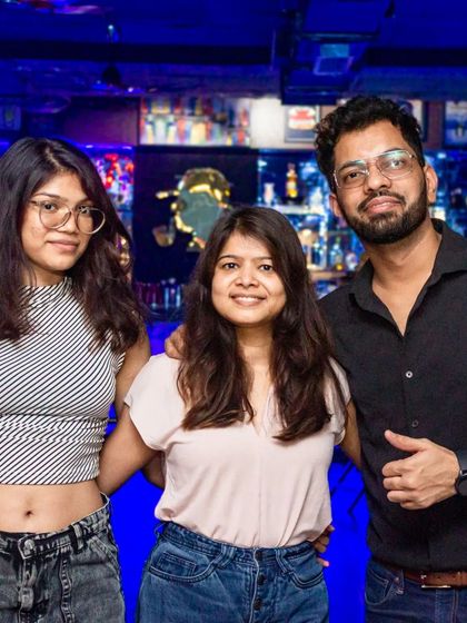 A trio of friends enjoying the cool vibe by the bar.
