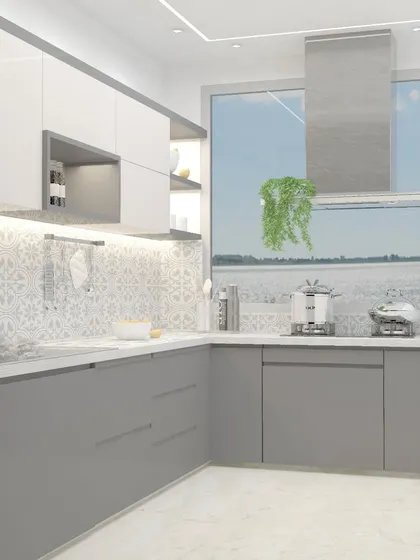 This kitchen design for a small flat features a beautiful patterned tile backsplash that adds personality. The two-tone grey and white cabinets keep the space feeling bright and open.
