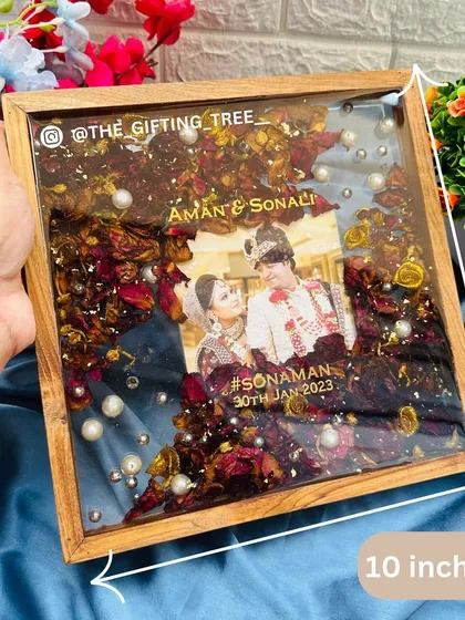 The 10-inch frame being held to show its scale and fine details.