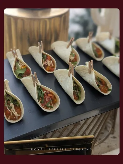 A closer look at my mini tacos, a popular choice for any event. These bite-sized delights are filled with a savory mixture and fresh greens, making them a flavorful and convenient option for guests to enjoy.
