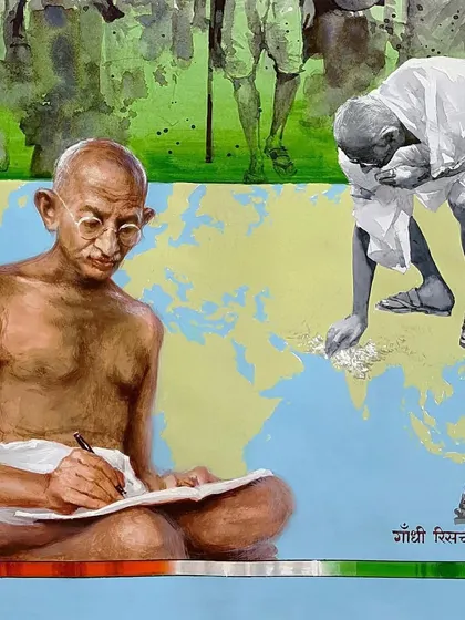 Another section of the Gandhi painting, showing him writing and cleaning the map of India, symbolizing his vision for the nation.