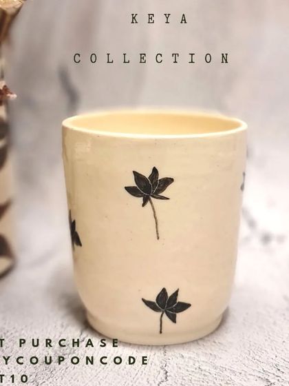 This tumbler is from my limited edition Keya collection, featuring my signature hand-painted lotus motif. It's an exclusive piece designed to welcome the spirit of monsoon into your home.