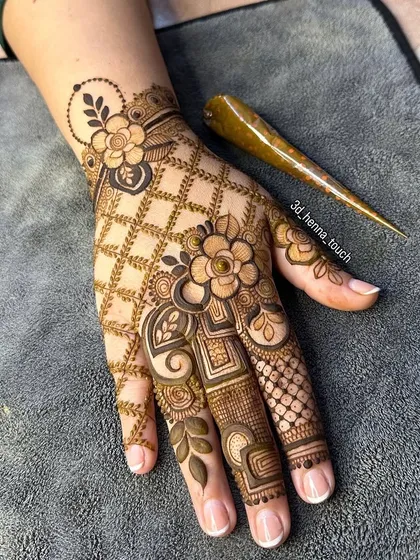 A beautiful floral net design that covers the back of the hand. This is a great design to practice your jaali (net) technique.